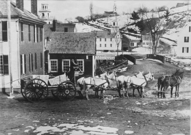 wagon passes by tavern